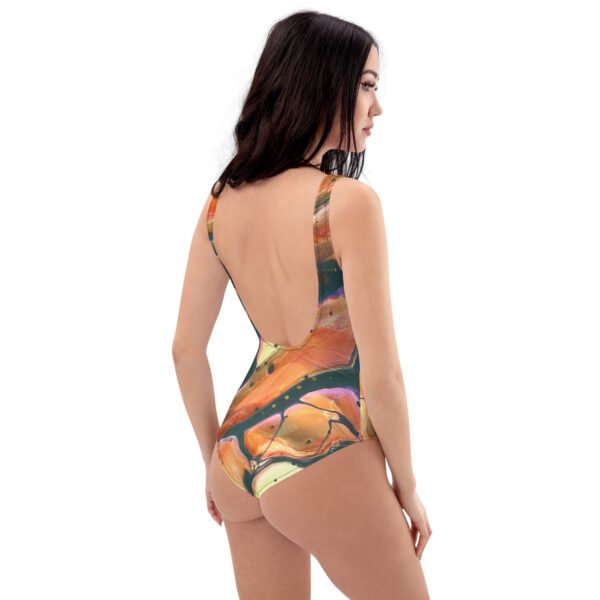 back side view of woman wearing Autumn Breeze one-piece swimsuit