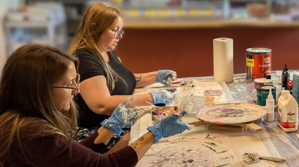 Students painting in Carolyn's class